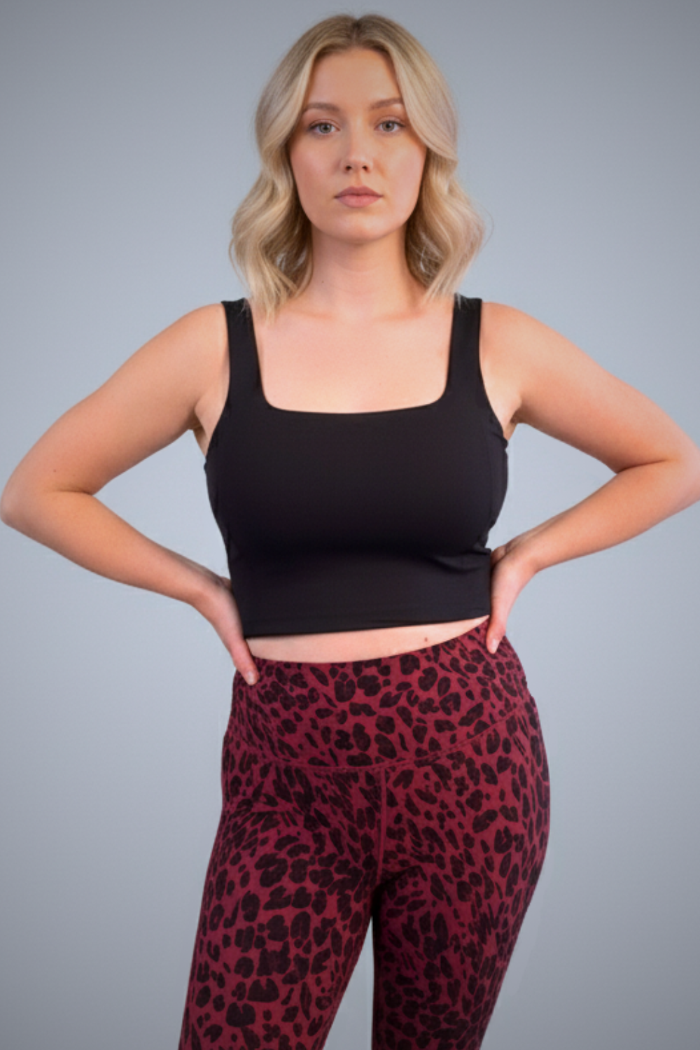 Wear Love More black Bardot square-neck tank shelf bra in recycled core compression fabric.