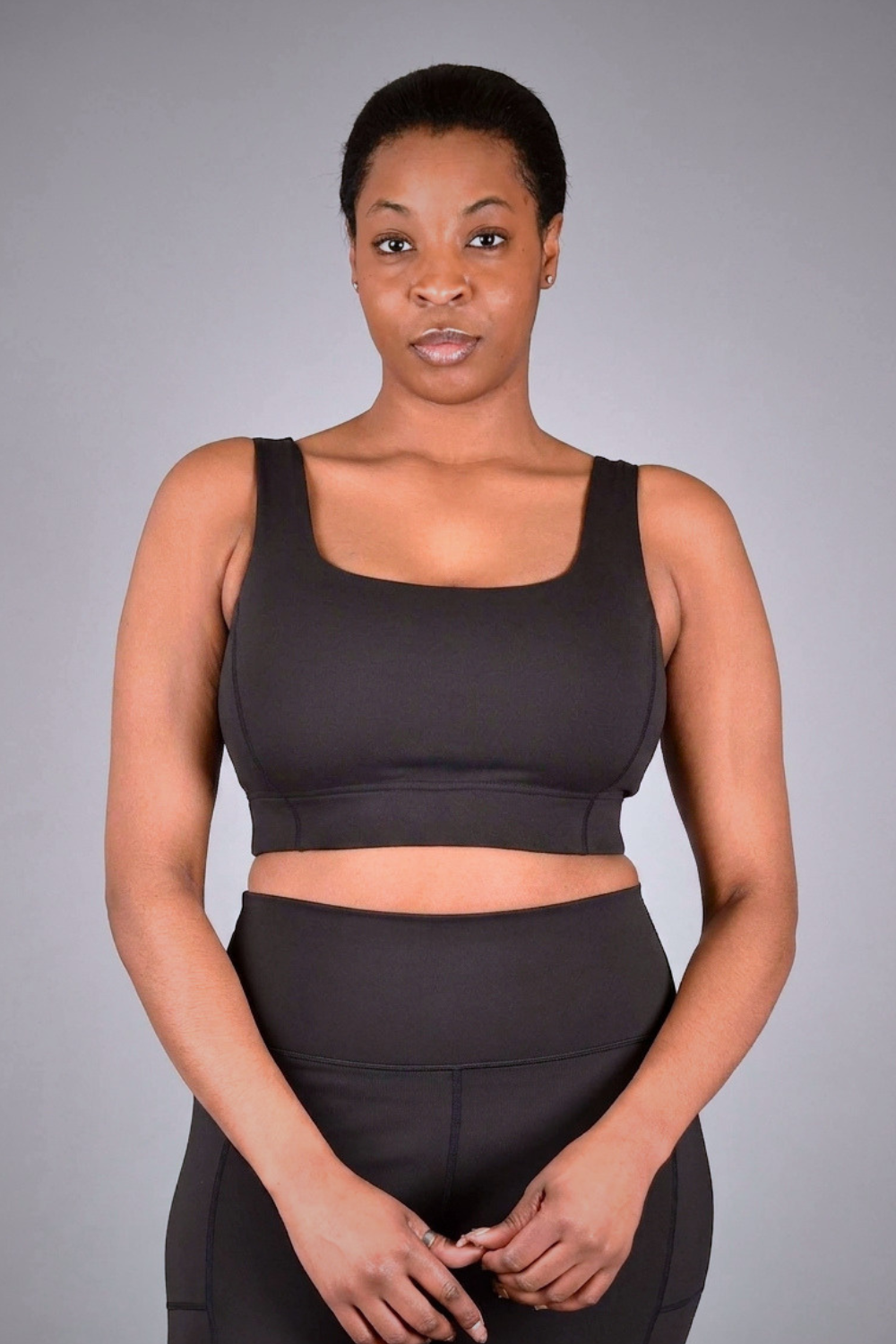 Wear Love More black Brigitte medium support square-neck sports bra  in recycled core compression fabric.
