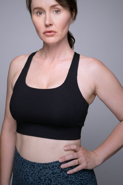 Wear Love More black Sabina high support scoop neck sports bra with back neck closure in recycled core compression fabric.