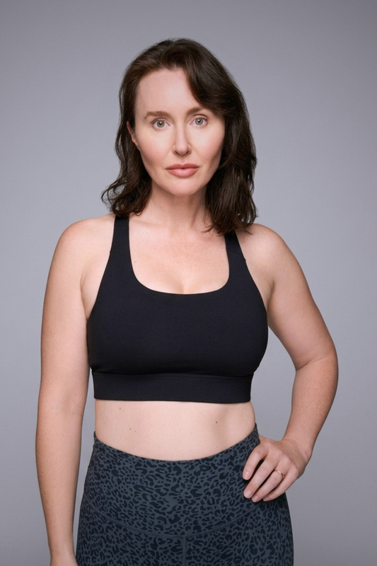 Wear Love More black Serena high support scoop neck sports bra with back neck closure in recycled core compression fabric.