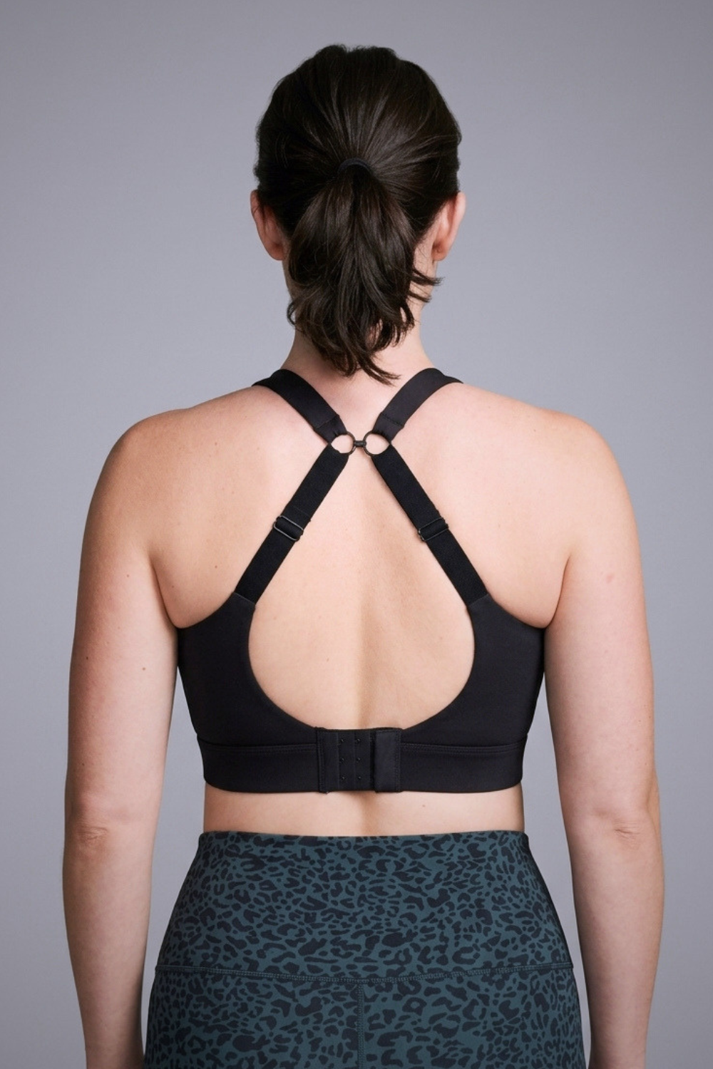 Wear Love More black Veda high support v-neck sports bra with back j-hook racer  in recycled core compression fabric.