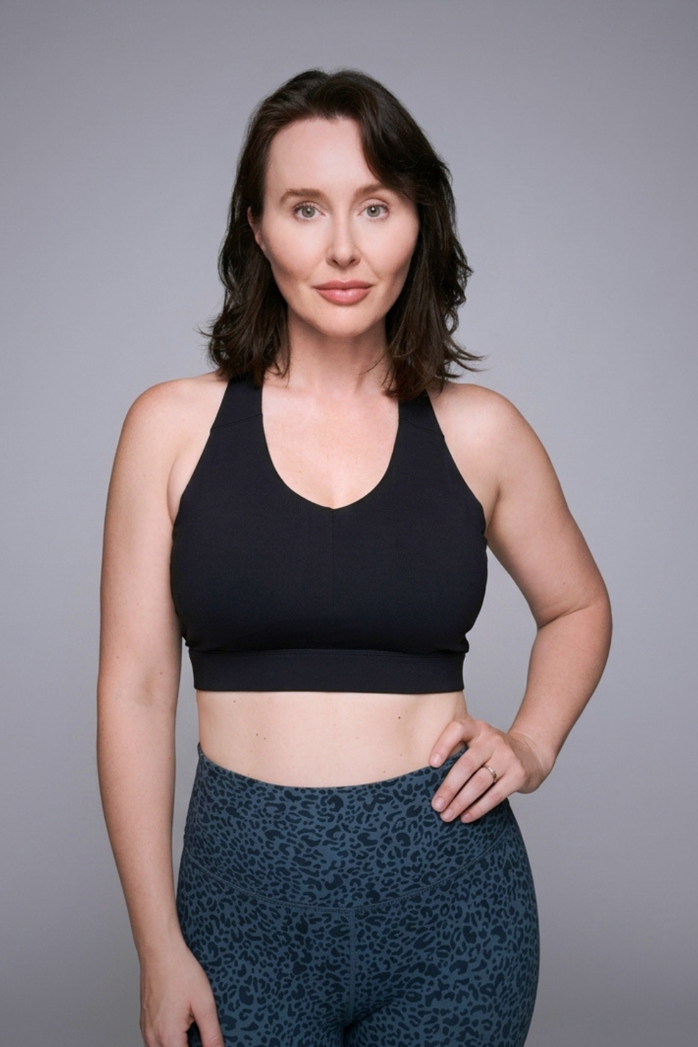 Wear Love More black Veda high support v-neck sports bra  in recycled core compression fabric.