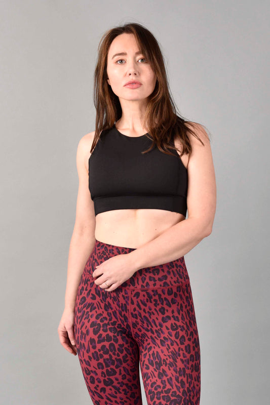 WEAR LOVE MORE Designer Sustainable Activewear.  Anna Longline High Neck Bra in Recycled Core Compression. Luxury Performance Fabric.  Matte Black finish.  Paired with Red Velvet Leopard Legging.
