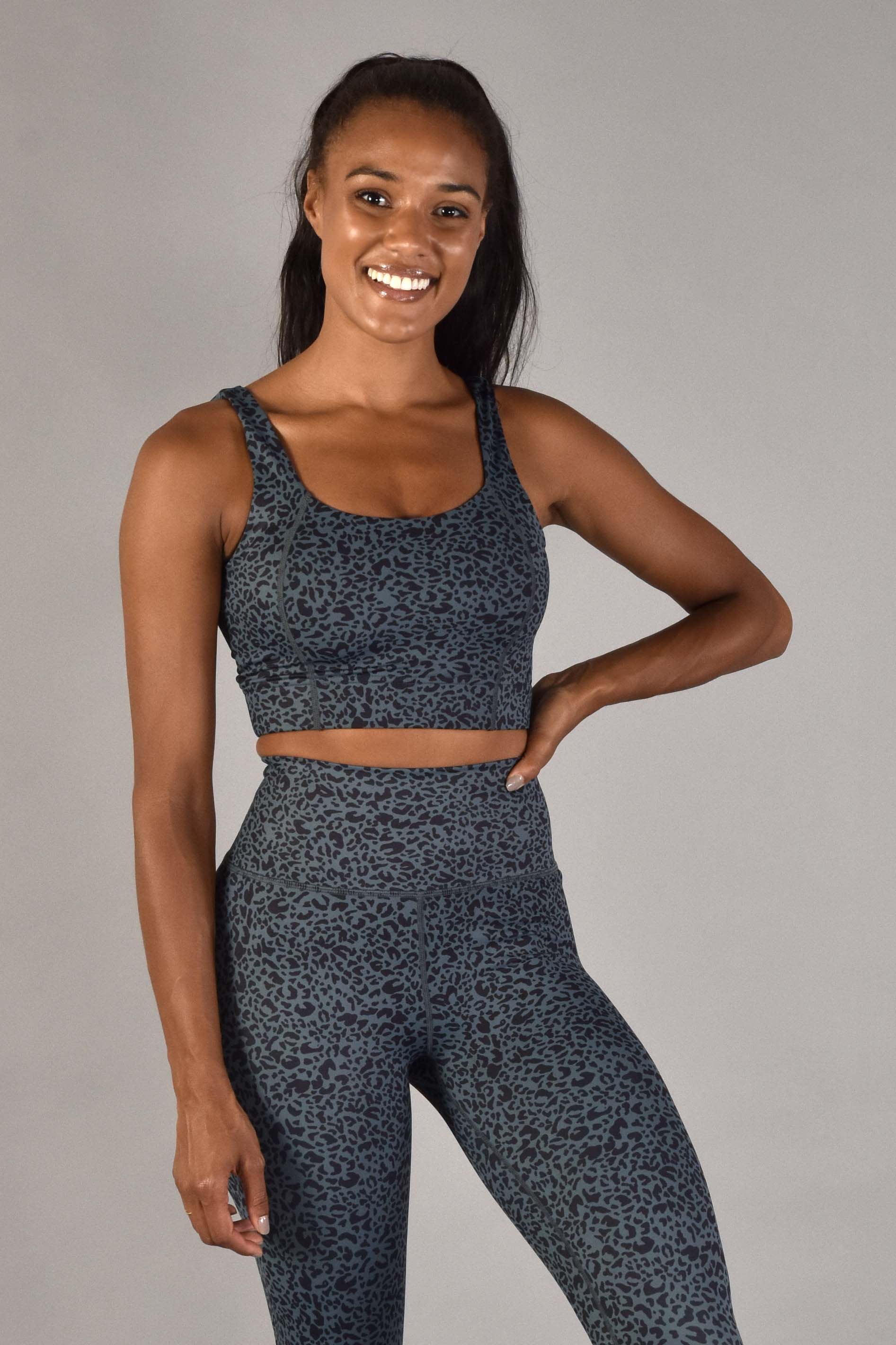 WEAR LOVE MORE Designer Sustainable Activewear.  Sophia Longline Bra in Emerald Leopard.  Dark Blue Green Leopard Print Bra Support Top.  Paired with 7/8 Emerald Leopard Legging.  Luxury Recycled Performance Fabric.