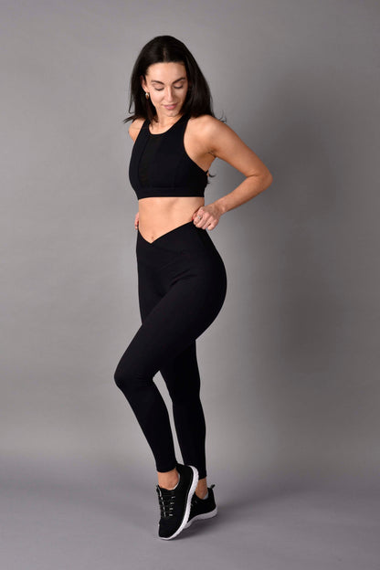 WEAR LOVE MORE Womens Sustainable Activewear High Rise Crossover Legging in Black paired with Stevie High Neck Mesh Bra reversed to Black