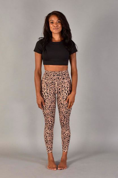 WEAWEAR LOVE MORE Designer Sustainable Activewear. Ultra High Rise Recycled Luxe 7/8 Legging in Nude Leopard.  Paired with Audrey Top in Matte Black.  Leopard Print Legging.  Nude Leopard Print Legging.